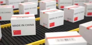 Shipping boxes labeled made in China on a conveyor belt