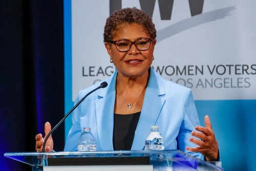 karen-bass2227317561jpg Woman speaking at a podium in blue jacket