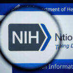 Outbreak Cargo? NIH Team Caught Mid-Flight magnifying glass over NIH logo on a website