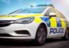 System Glitch, Catastrophe Unleashed Police car driving with flashing lights visible