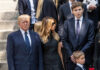 Trump Celebrates 80 With Diplomacy And Spectacle Three adults and a child in formal black attire standing on stone steps