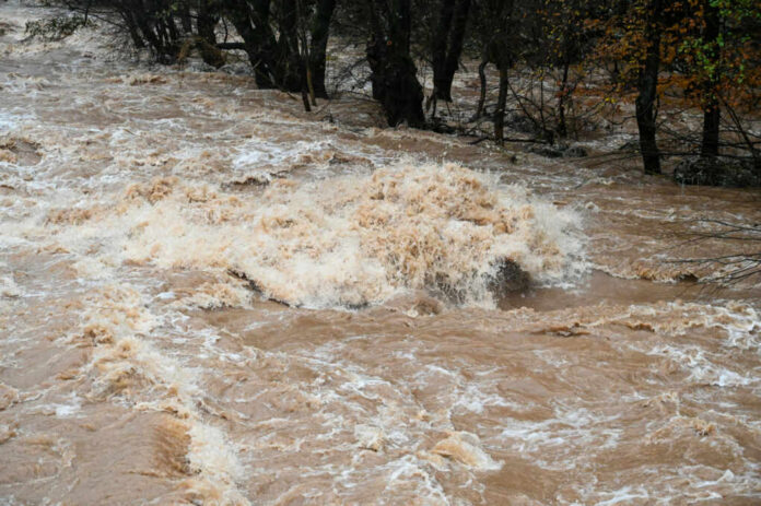raging-river2231298229jpg Flooded river with muddy, turbulent water