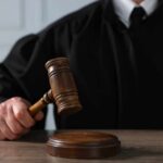 Trump Weighs 250 Presidential Pardons A judge holding a gavel above a wooden block