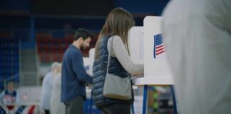 A person casting their vote at a polling station