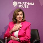 Pelosi’s Endorsement Upends Moderates A woman in a pink suit speaking at a conference