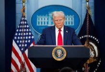 GOP Senators Hand Democrats A Win – Trump Furious! A political figure at a podium during a press conference