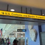 Federal Bomb Charges Follow Airport Scare Sign for U.S. Customs and Border Protection at an airport