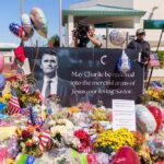 Media Circus or Justice? Judge Rolls Dice Memorial with flowers, balloons, flags, and a large tribute poster