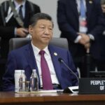 Congress Slams Brakes On China Influence Senior official in a blue suit sits at an international conference table