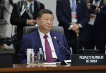 Congress Slams Brakes On China Influence Senior official in a blue suit sits at an international conference table