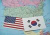 Alliance In Crisis — What Broke? United States and South Korea flags on a map of North America