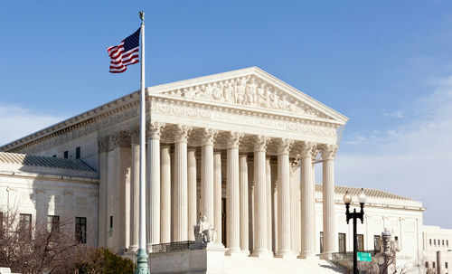 supreme-court_96721225 United States Supreme Court building with American flag