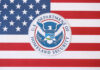 DHS Smear Explodes — Evidence Nowhere U.S. Department of Homeland Security seal on American flag