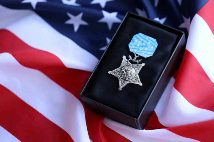 us-navy-medal-of-honor2499052095jpg Medal of Honor on American flag background