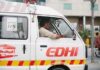 Unsafe School Claims Fourteen Young Lives Ambulance driver in a white EDHI van