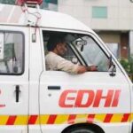 Unsafe School Claims Fourteen Young Lives Ambulance driver in a white EDHI van