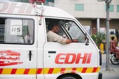 1439732558-1 Ambulance driver in a white EDHI van