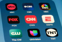 Trump Renews Broadcast License Threats Smartphone screen showing TV network app icons