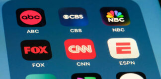 Smartphone screen showing TV network app icons