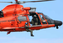 Flood Heroes Save Hundreds Across Texas Rescue helicopter with crew performing hoist operation