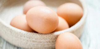 Brown eggs in a woven basket.
