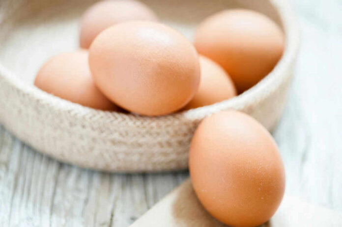 egg147772357 Brown eggs in a woven basket.