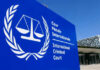 White House Declares ICC A Threat International Criminal Court sign with scales of justice.