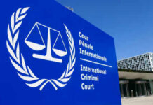 White House Declares ICC A Threat International Criminal Court sign with scales of justice.