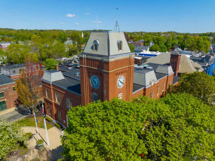 melrose-city-hall-aerial-view2304053085jpg Clock tower surrounded by trees and buildings daytime