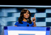 Hypocrisy Charge Hits Michelle’s Book I dont know who this is speaking at a podium