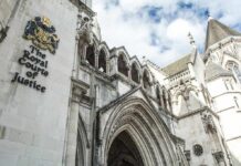 Police Continue Probe Into Former PM’s Murder Royal Courts of Justice exterior with Gothic arches