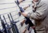 Court Just Saved Your Gun Rights? Person examining a black rifle in a gun store