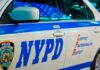 Another Violent Day In Manhattan NYPD patrol car side with blue stripe and door lettering