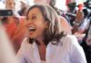 Critics Target Kamala Harris’ Malibu Move smiling woman in a crowd