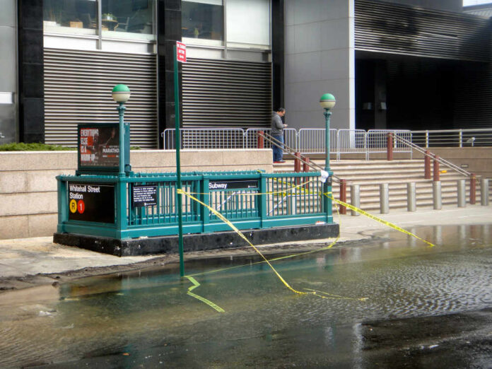 New,York,,Ny,-,October,31,2012:,Water,Being,Pumped Houses battered by hurricane winds and flooding