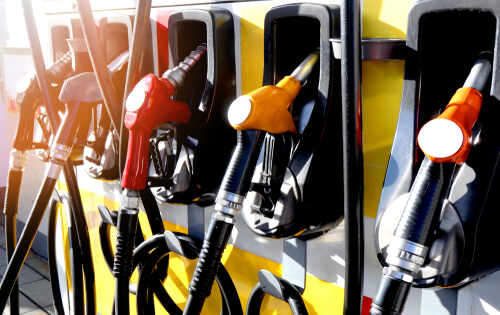 Red,And,Yellow,Colorful,Fuel,,Gasoline,Dispenser Close-up of multiple gas pumps at a fuel station