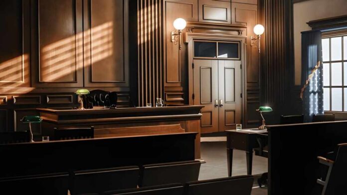 shutterstock_2056420760 Interior view of a courtroom with wooden benches and large murals