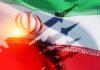 Iran Pummeled — But What’s The Endgame? Iranian flag with silhouettes of missiles and military vehicles