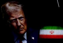 Israel Tip Sparks Trump War Warning Close-up portrait of a man with a serious expression, with the Iranian flag in the background