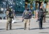 ICE Reviews Tactics After Fatal Shootings Law enforcement officers in tactical gear during an operation