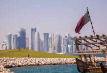 Doha Becomes Diplomatic Battleground Doha skyline with Qatar flag and dhow boat