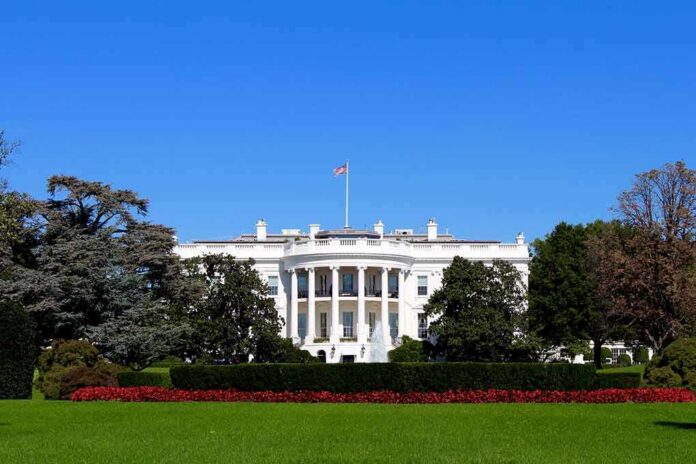 The White House facade with flag and gardens