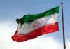 Iranian flag waving on a pole
