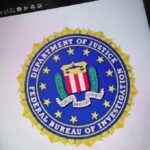 Declassified FBI Memos Rattle Congress FBI seal displayed on a smartphone screen