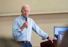 Hunter Biden’s Wild Motorcade Confession man speaking into a microphone at a podium