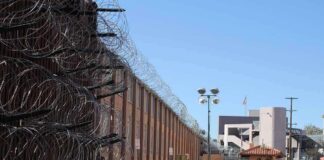 Razor wire along a prison perimeter fence