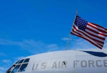 American flag on U.S. Air Force aircraft against blue sky