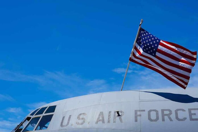 shutterstock_2159722029 American flag on U.S. Air Force aircraft against blue sky