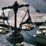 Trump Boasts Profit From Yen Lifeline Antique balance scale with gold coins on wooden table