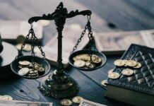 Trump Boasts Profit From Yen Lifeline Antique balance scale with gold coins on wooden table